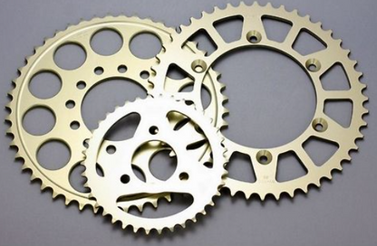Two brass sprockets on a gray background