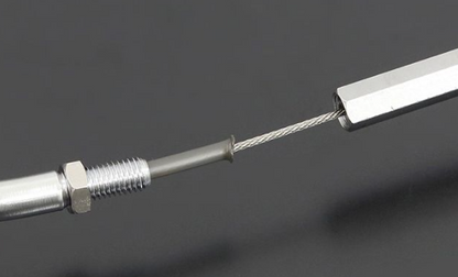 Metallic cable with a connector on a dark background