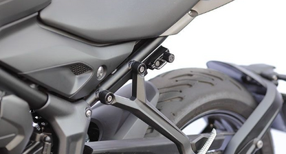 Close-up of a motorcycle's seat and rear area with a blurred background