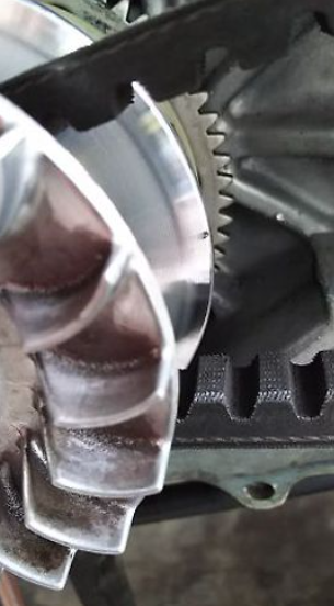 Close-up of mechanical components with gears and metal parts.