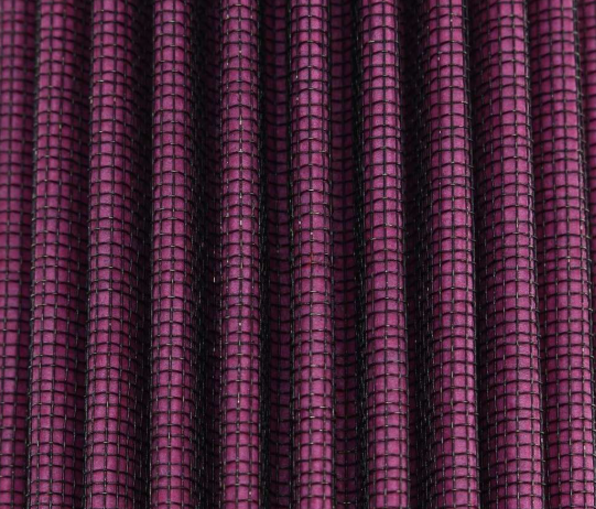 Close-up of purple textured fabric with a grid pattern