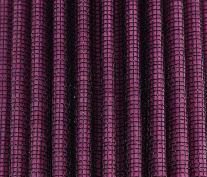 Close-up of purple textured fabric with a grid pattern
