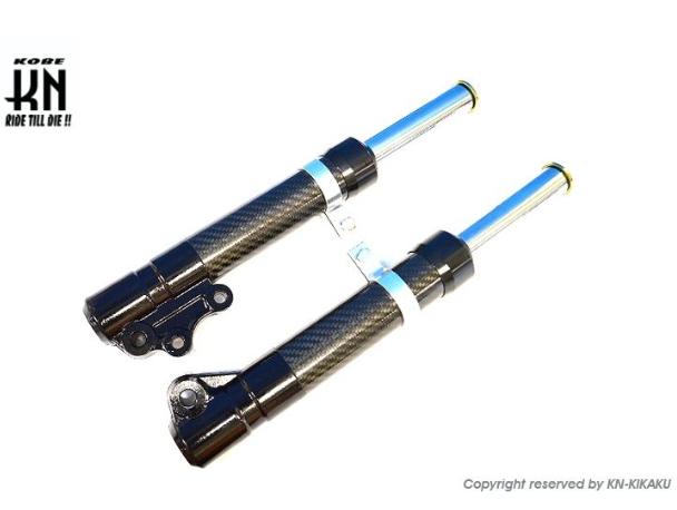 Two carbon fiber shock absorbers with blue accents on a white background, featuring the KIKAKU logo.