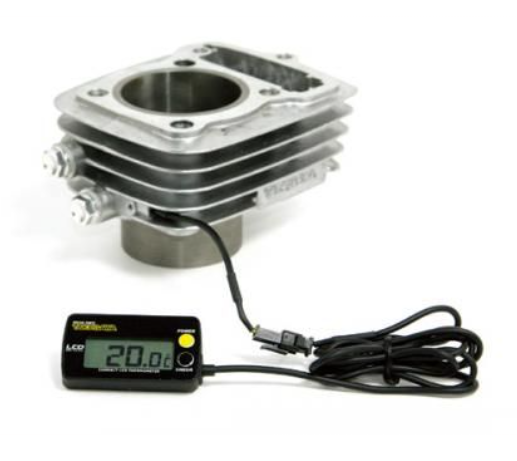 Engine cylinder with digital thermometer on a white background